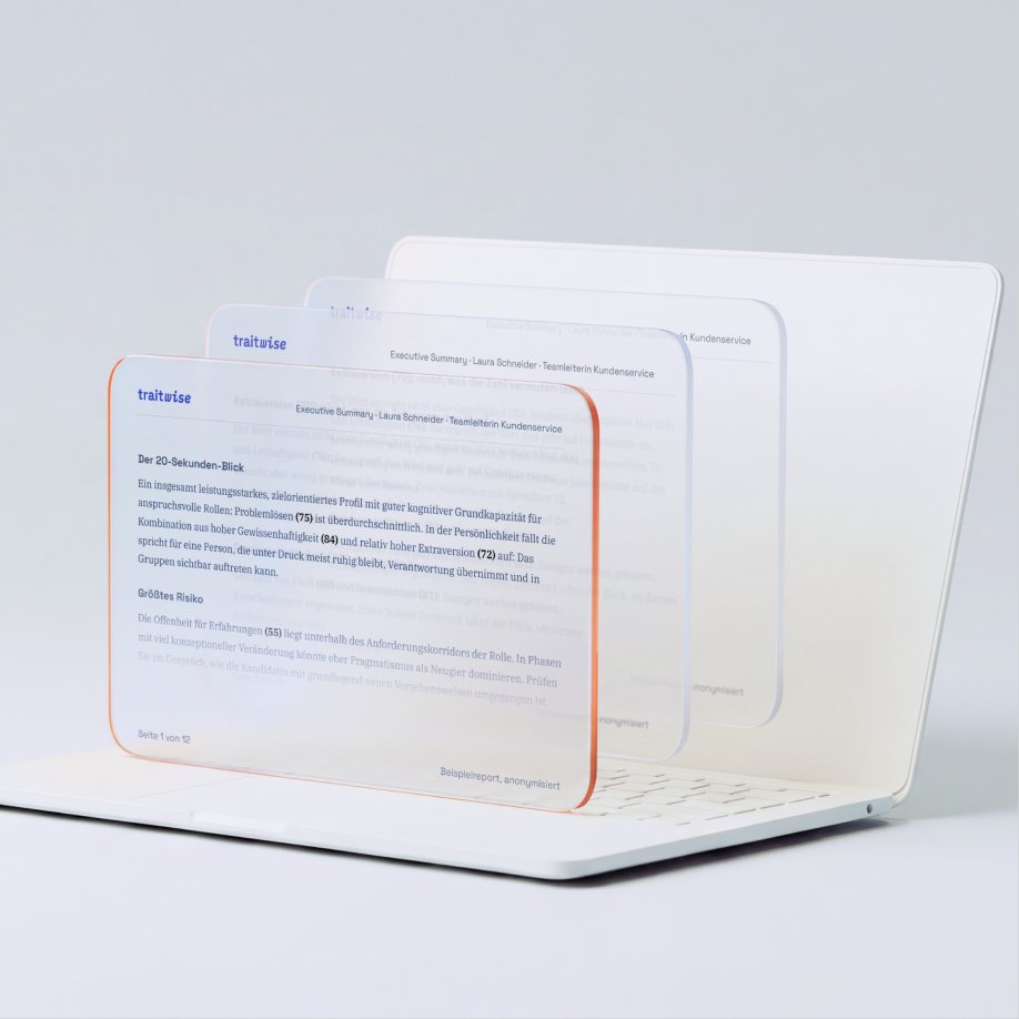 Laptop with fanned report pages